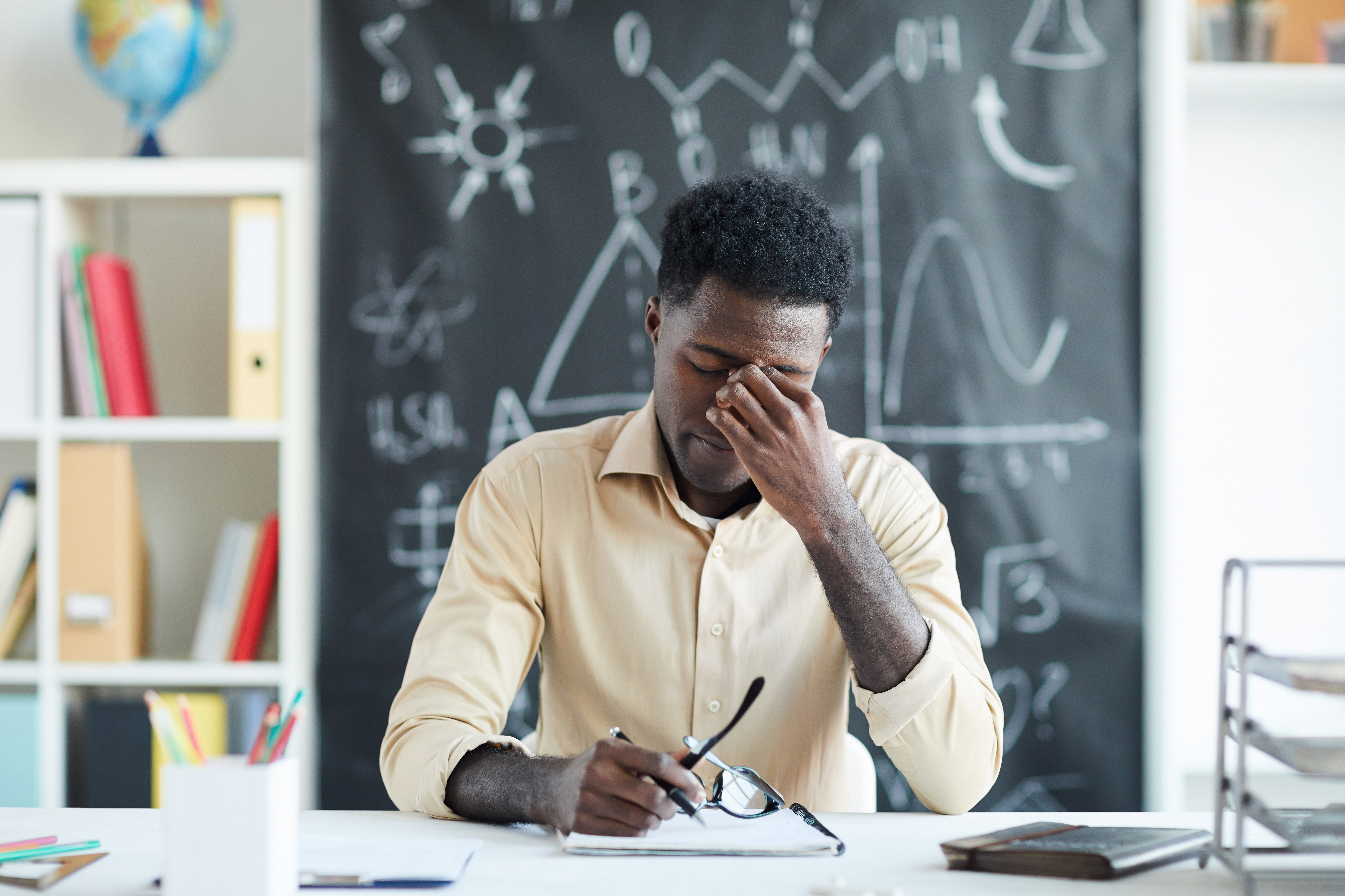 Photo of a teacher looking distressed