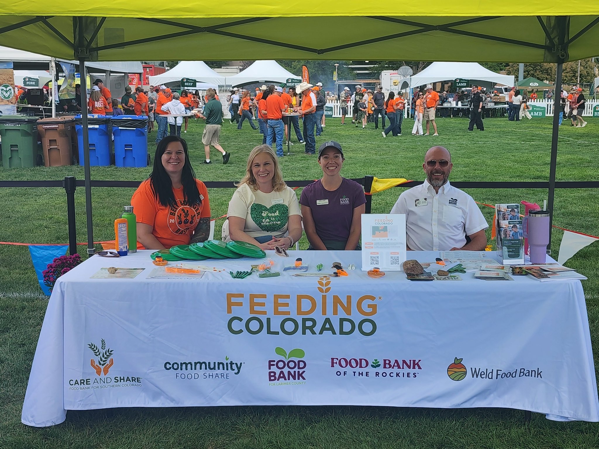 Photograph of Feeding Colorado employees at an event booth.