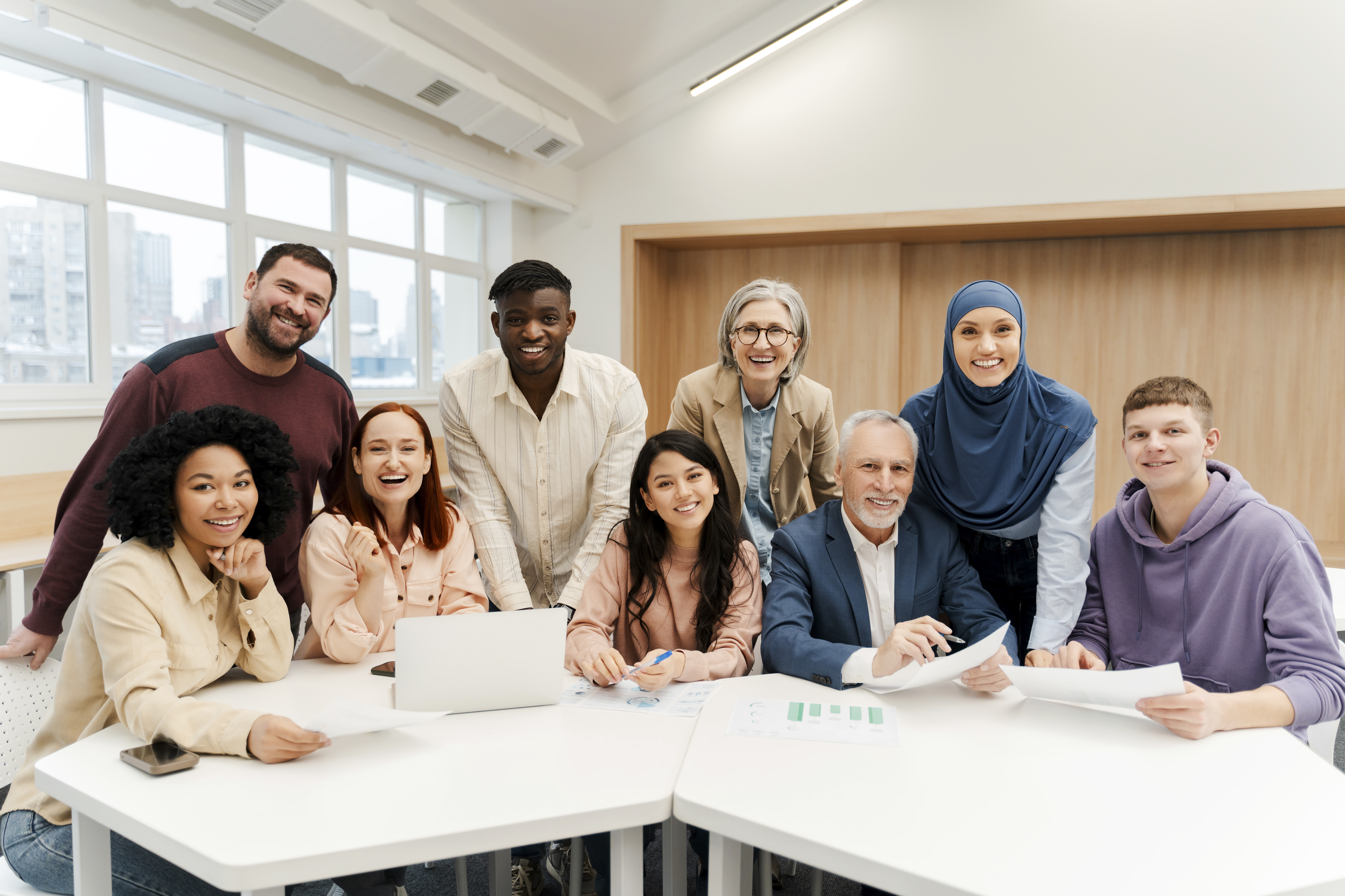 Group of teachers and students smiling at the camera